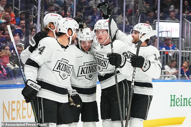 Los Angeles Kings' Artemi Panarin (10) celebrates with teammates after scoring during the first period of an NHL hockey game against the New York Islanders, Thursday, Oct. 22, 2026, in Elmont, N.Y. (AP Photo/Frank Franklin II)
