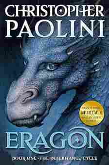 Book cover of "Eragon" by Christopher Paolini featuring the detailed, blue-scaled face of a dragon w...