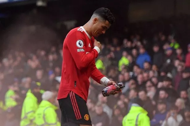 Manchester United's Portuguese striker Cristiano Ronaldo reacts to their defeat as he leaves after the English Premier League football match between Everton and Manchester United at Goodison Park in Liverpool, north west England on April 9, 2022