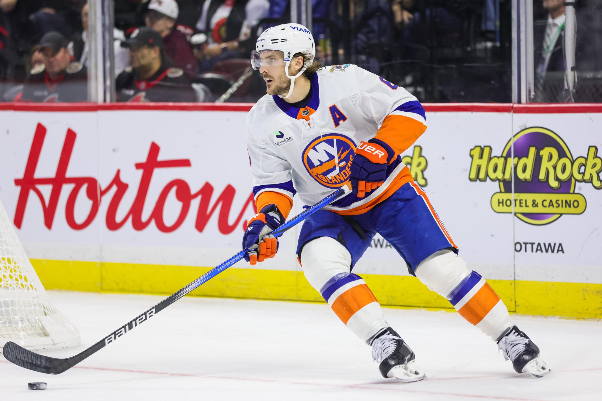 An New York Islanders player skates on the ice during a game against the Ottawa Senators.