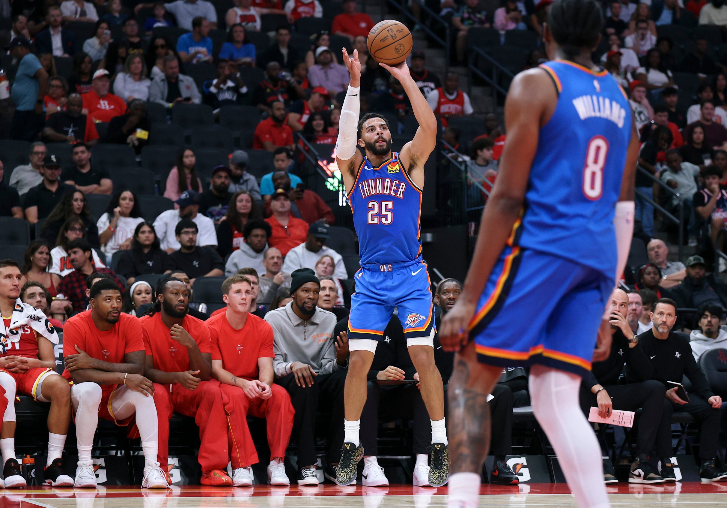 Oct 15, 2026; Houston, Texas, USA; Oklahoma City Thunder guard Ajay Mitchell (25) shoots the ball during the third quarter against the Houston Rockets at Toyota Center. Mandatory Credit: Troy Taormina-Imagn Images