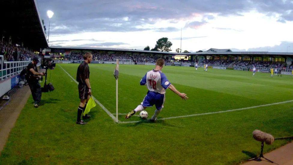 A Rushden & Diamonds player takes a corner kick at Nene Park.