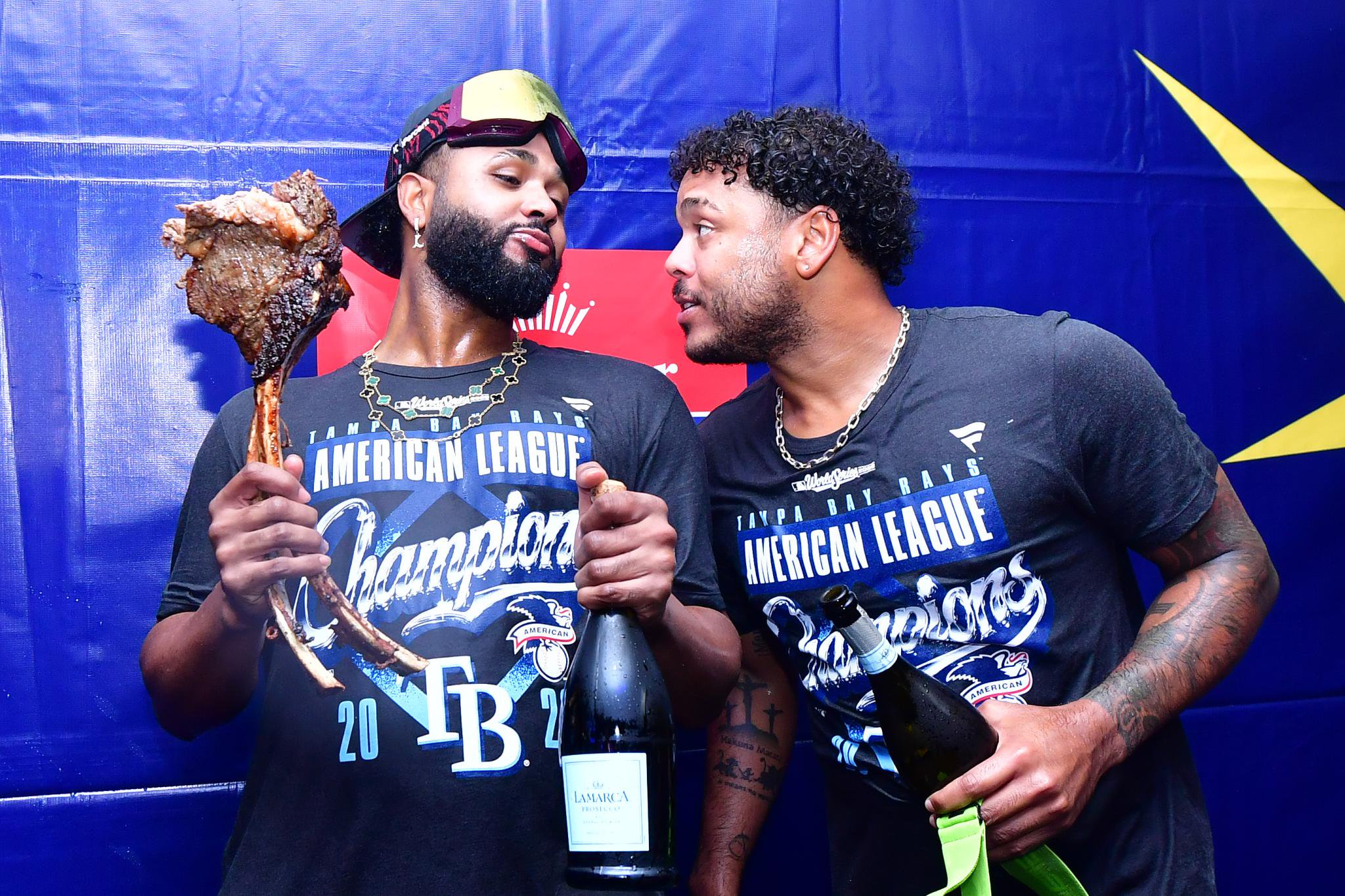Junior Caminero and Freddy Peralta of the Tampa Bay Rays celebrate their American League Championship Series victory.