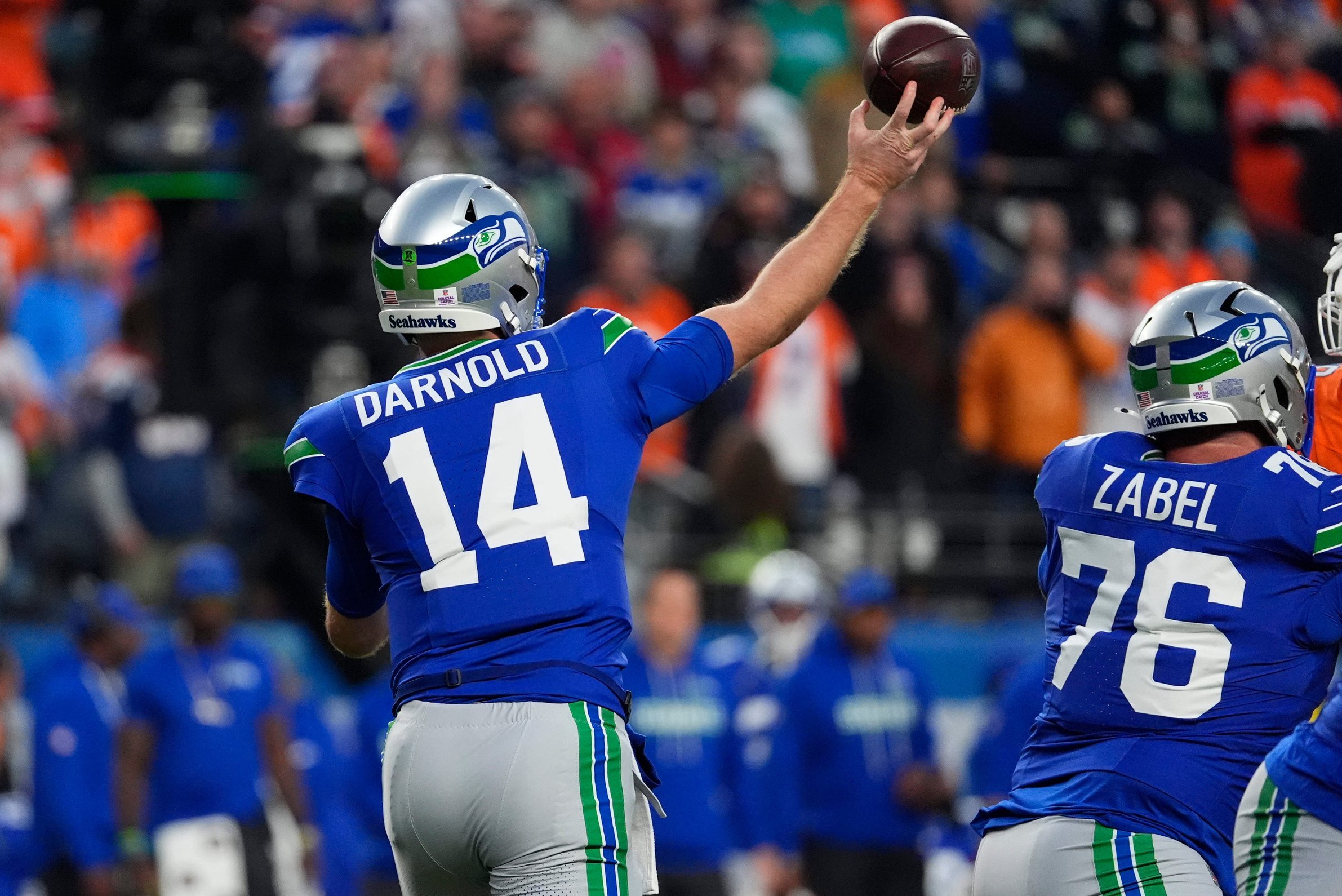 Oct 15, 2026; Denver, Colorado, USA;  Seattle Seahawks quarterback Sam Darnold (14) throws in the first quarter against the Denver Broncos at Empower Field at Mile High.  Mandatory Credit: Ron Chenoy-Imagn Images