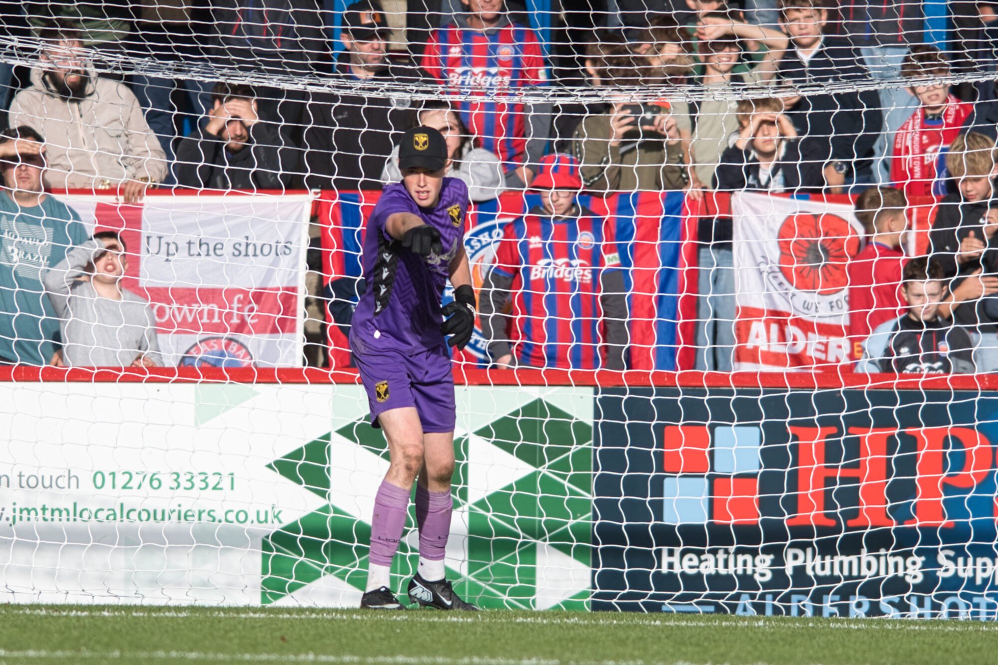 Tadley Calleva's Donnacha Burke in front of Aldershot Town's East Bank. Photo: Rob Mellor.