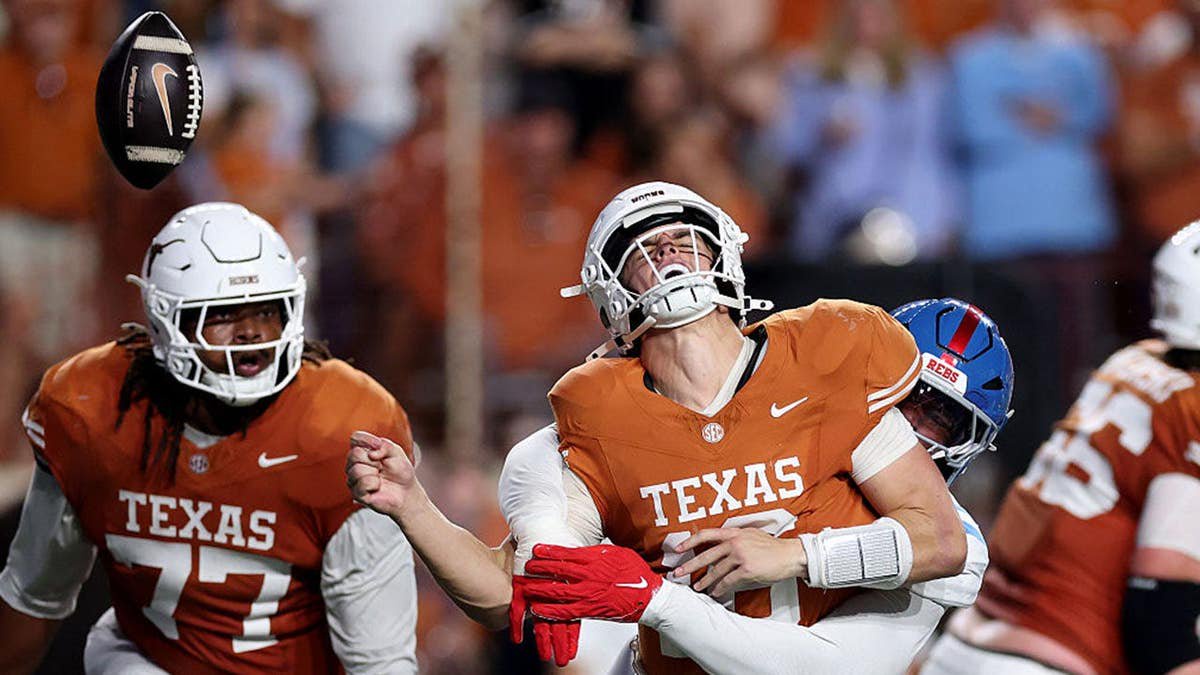 Blake Purchase #3 sacks Arch Manning #16, forcing a fumble during a football game.