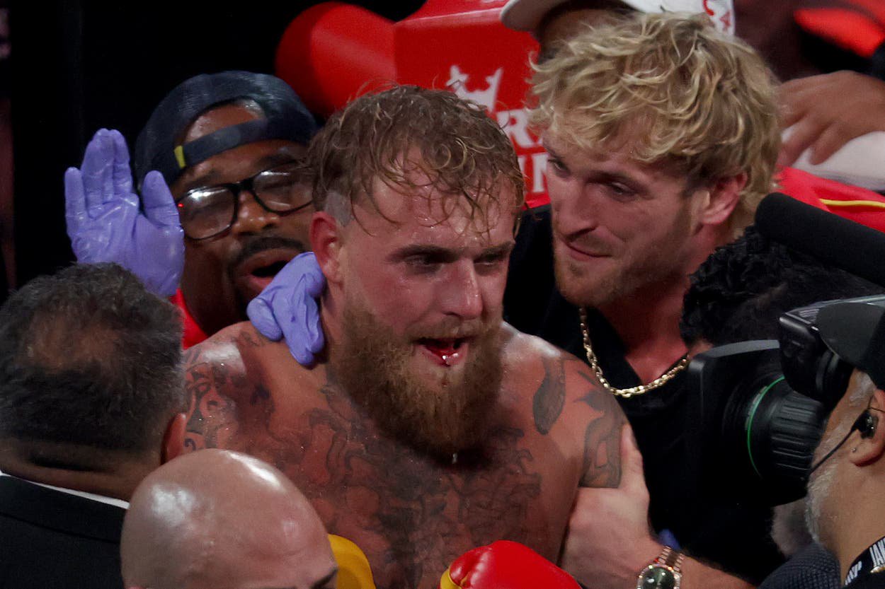 Jake Paul (centre) after his stoppage by Anthony Joshua last December
