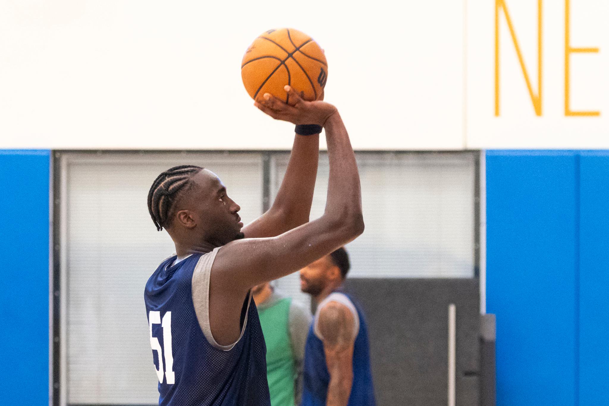 New York Knicks forward Mohamed Diawara shoots a basketball during practice.