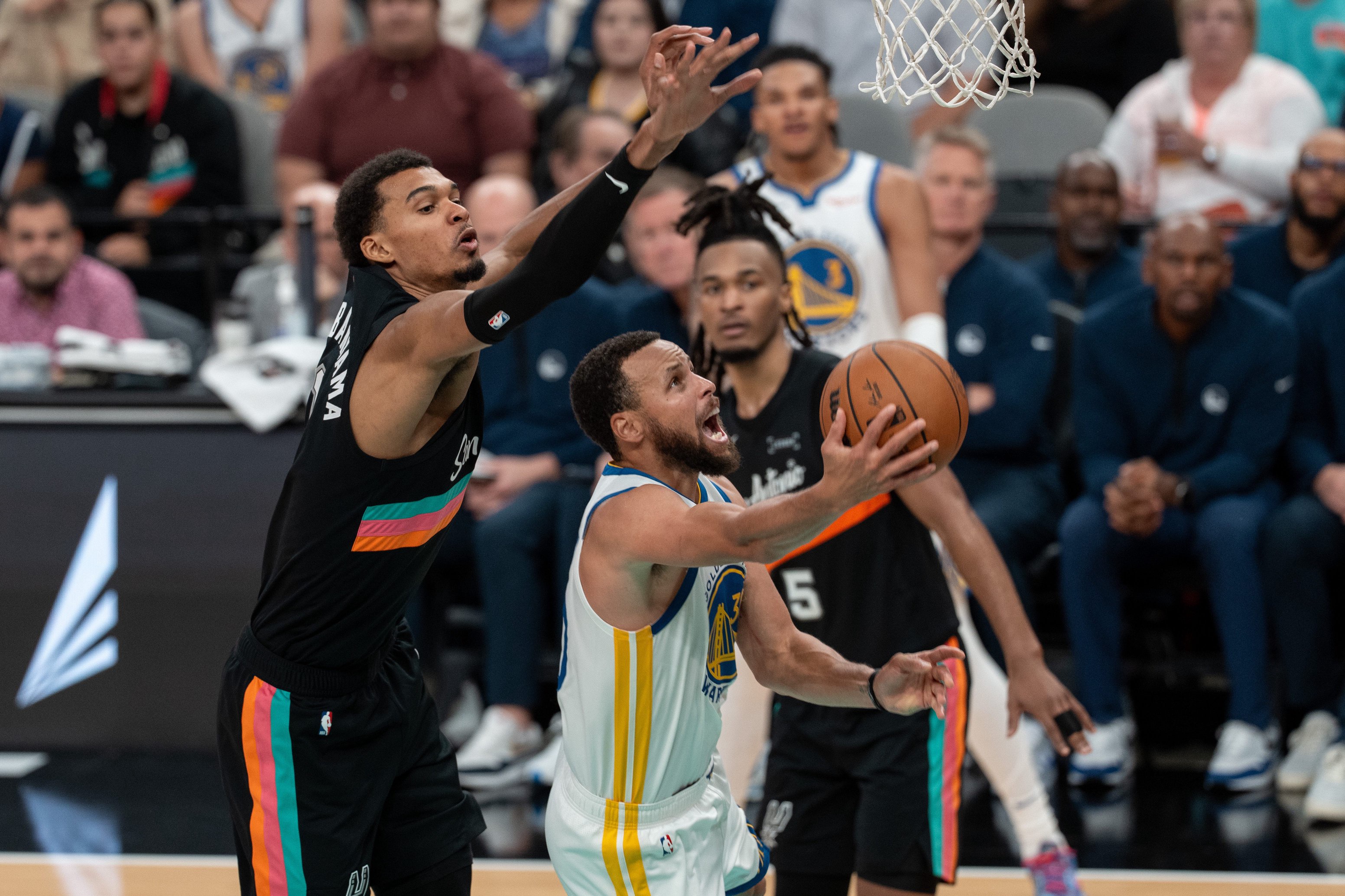 Nov 12, 2025; San Antonio, Texas, USA; Golden State Warriors guard Stephen Curry (30) shoots in front of San Antonio Spurs forward Victor Wembanyama (1) in the second half at Frost Bank Center. Mandatory Credit: Daniel Dunn-Imagn Images