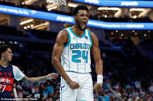 Charlotte Hornets forward Brandon Miller reacts after dunking against the Washington Wizards during the first half of an NBA basketball game in Charlotte, N.C., Monday, Oct. 26, 2026. (AP Photo/Nell Redmond)