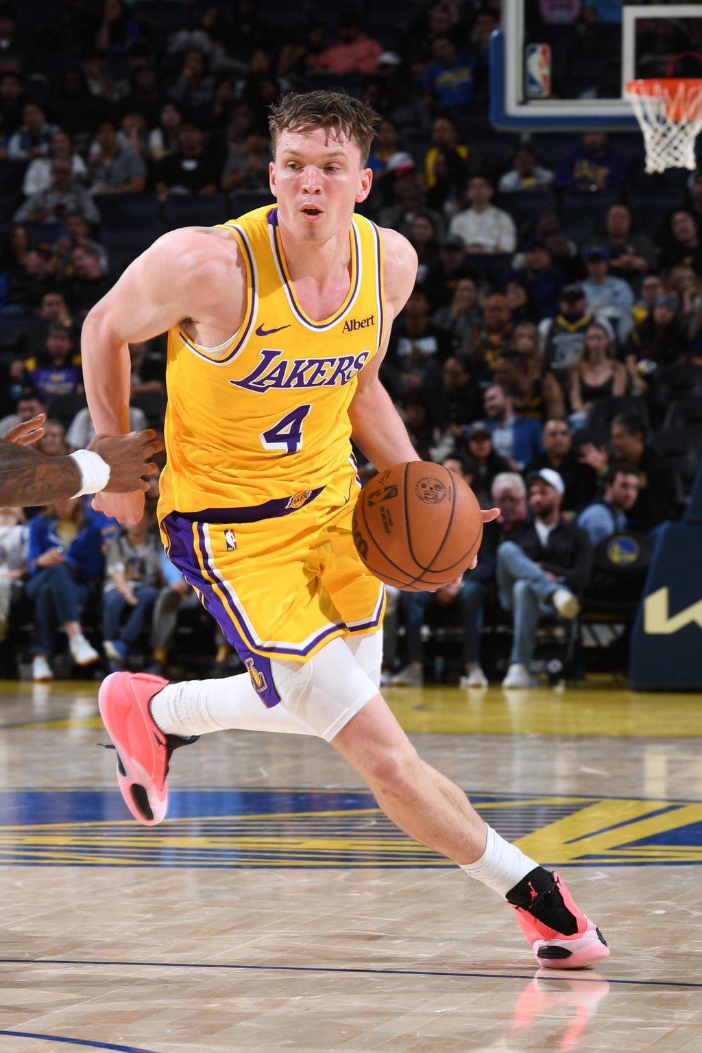 Dalton Knecht (4) of the Los Angeles Lakers handles the ball against the Golden State Warriors during a preseason game at Chase Center in San Francisco, California, Tuesday, Oct. 6, 2026.