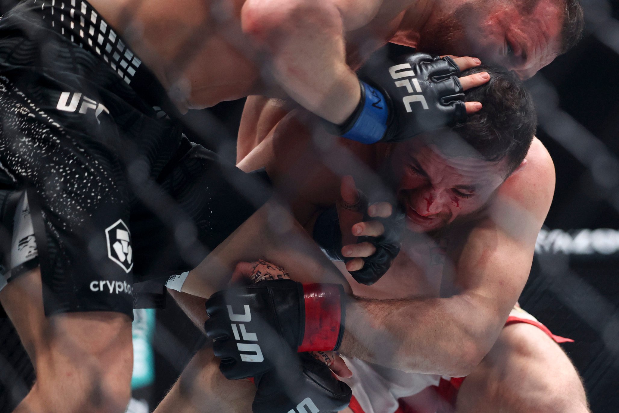 LAS VEGAS, NEVADA - DECEMBER 06: Merab Dvalishvili of Georgia grapples with Petr Yan of Russia during a bantamweight title fight during UFC 323 at T-Mobile Arena on December 06, 2025 in Las Vegas, Nevada. (Photo by Ian Maule/Getty Images)