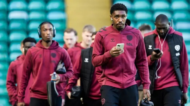Hearts' Malachi Fagan-Walcott leads his team-mates into Celtic Park