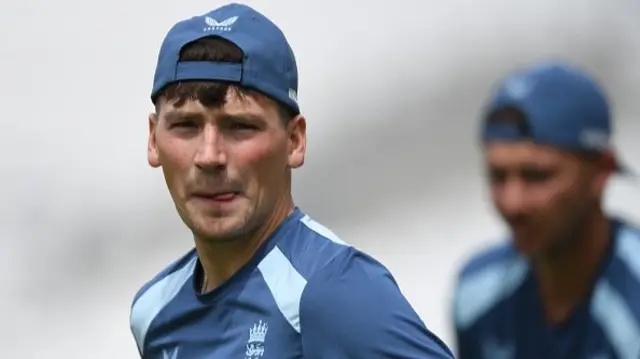 Henry Crocombe of England looks on