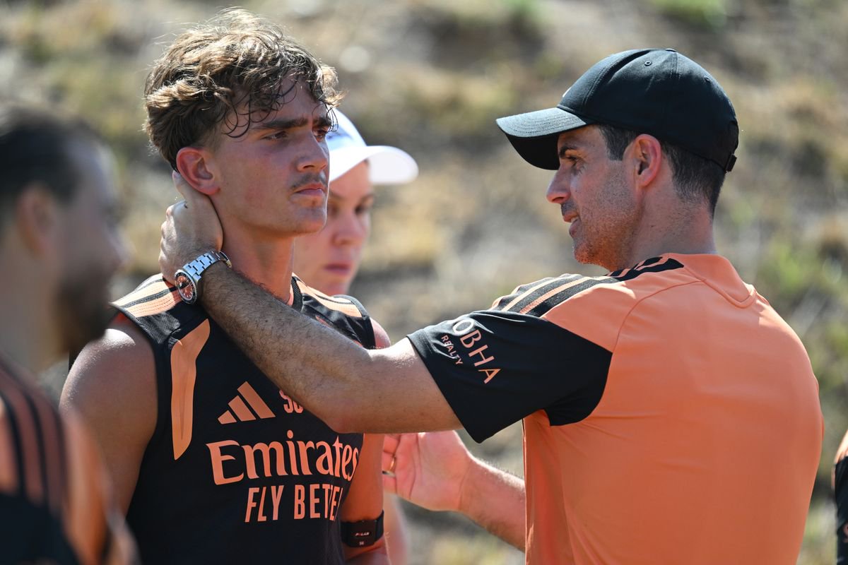 Arsenal manager Mikel Arteta with Max Dowman during a training session at Hotel Camiral de Caldes de Malavella on July 28, 2026 in Girona, Spain.