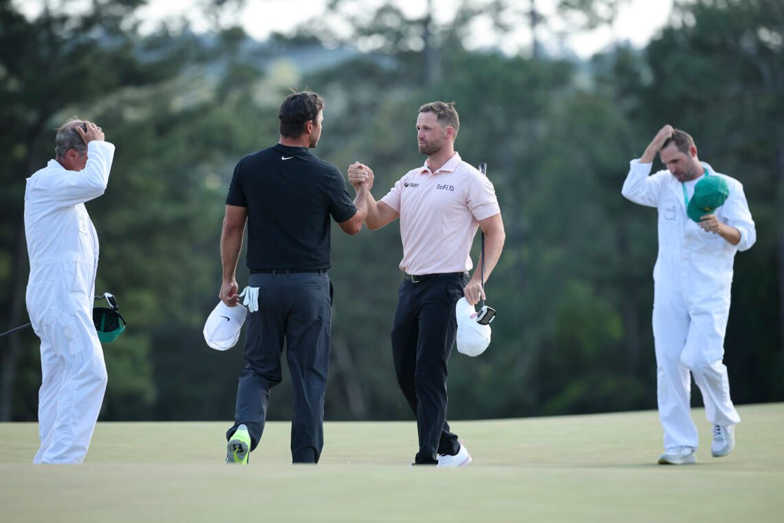 Brooks Koepka and Wyndham Clark shake hands on the 18th green after the final round of the 2026 Masters at Augusta National