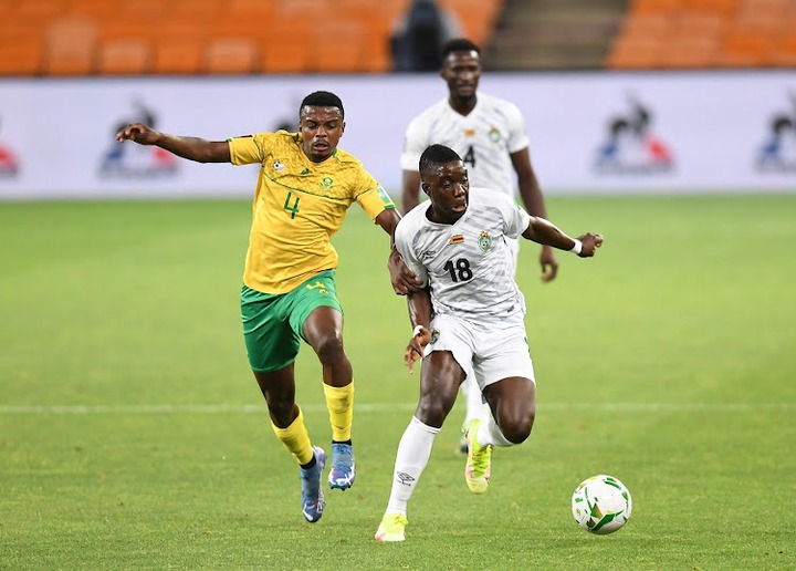 Bafana Bafana's Teboho Mokoena challenges Marvelous Nakamba of Zimbabwe in the 2022 Fifa World Cup, qualifier at FNB Stadium in Johannesburg on November 11 2021.