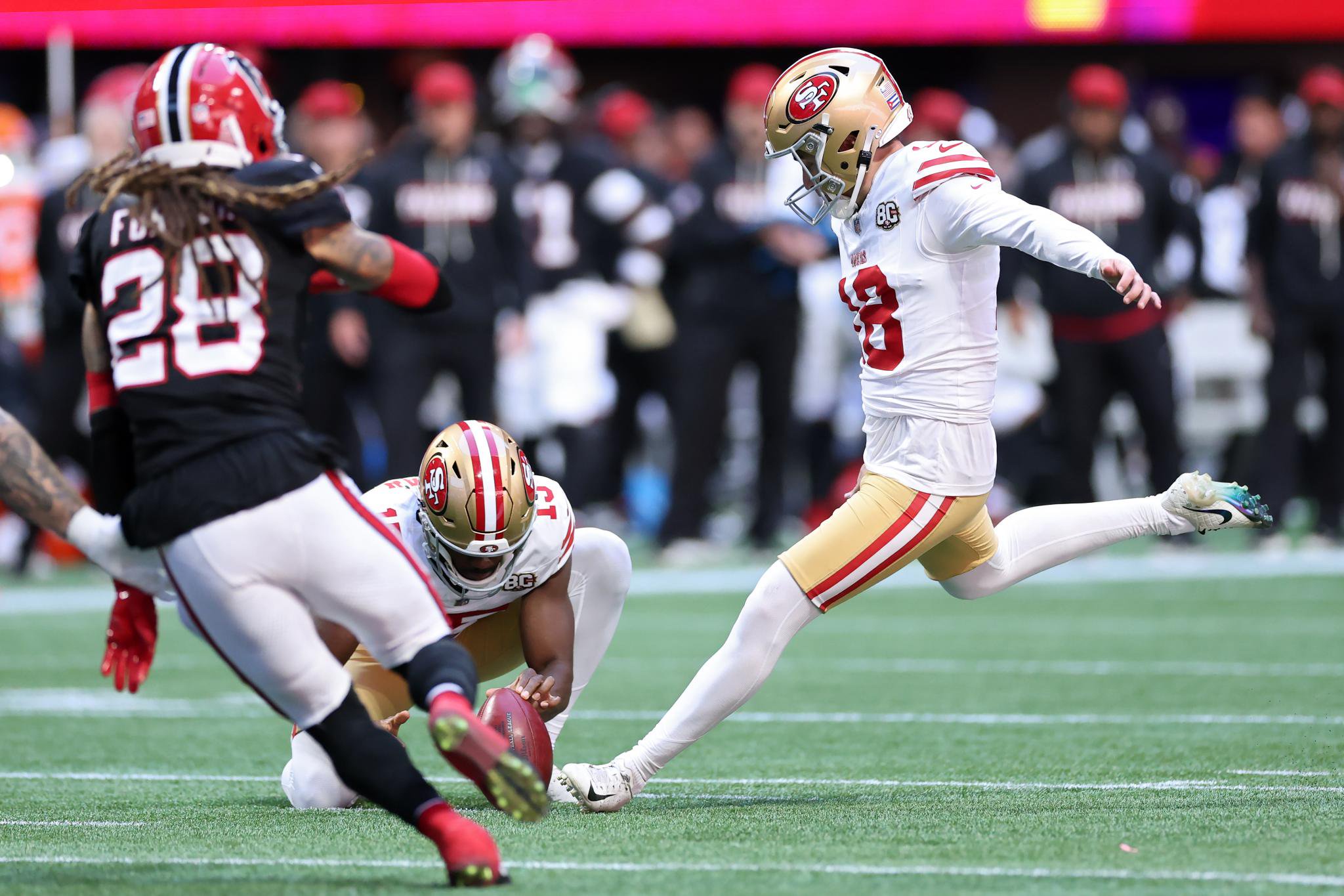 San Francisco 49ers kicker Eddy Pineiro (18) kicks an extra point against the Atlanta Falcons.