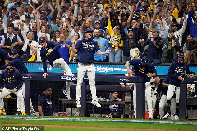 The Milwaukee Brewers celebrate their win in Game 2 after trailing 4-0 in the top of the first
