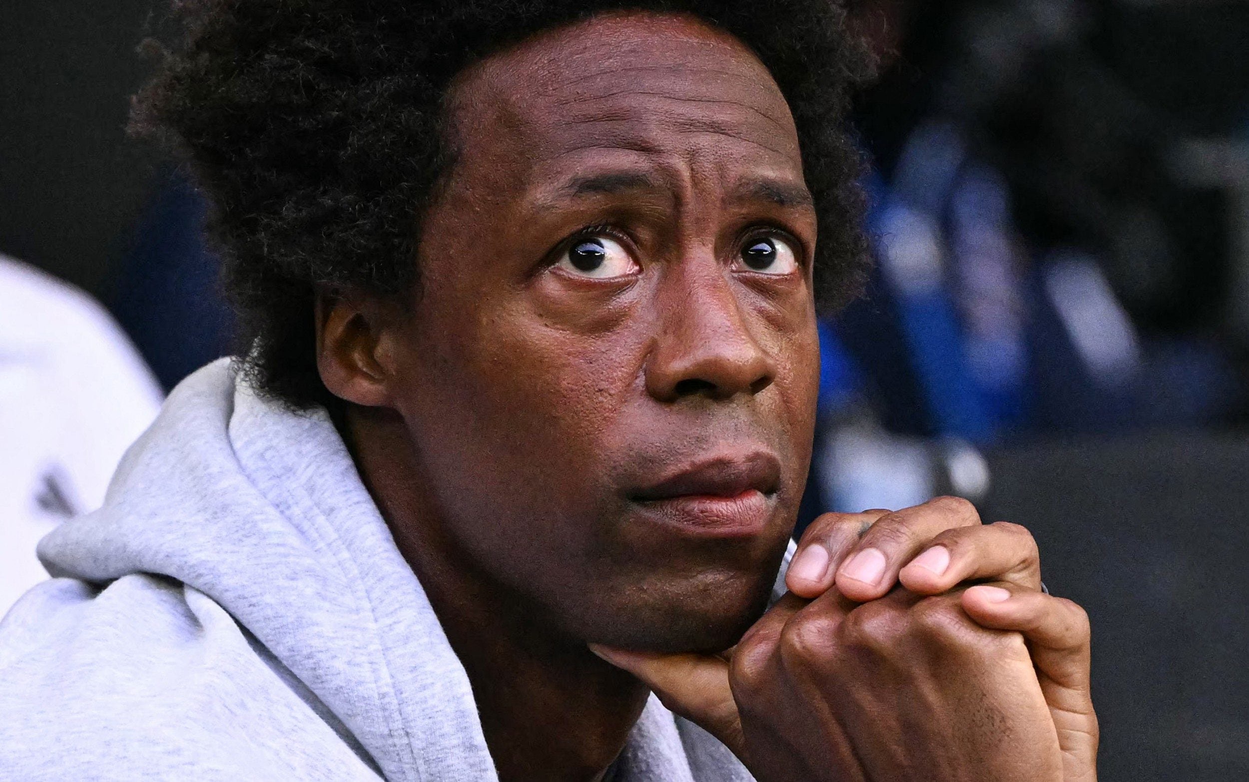 France's Gael Monfils watches the women's singles semi-final match
