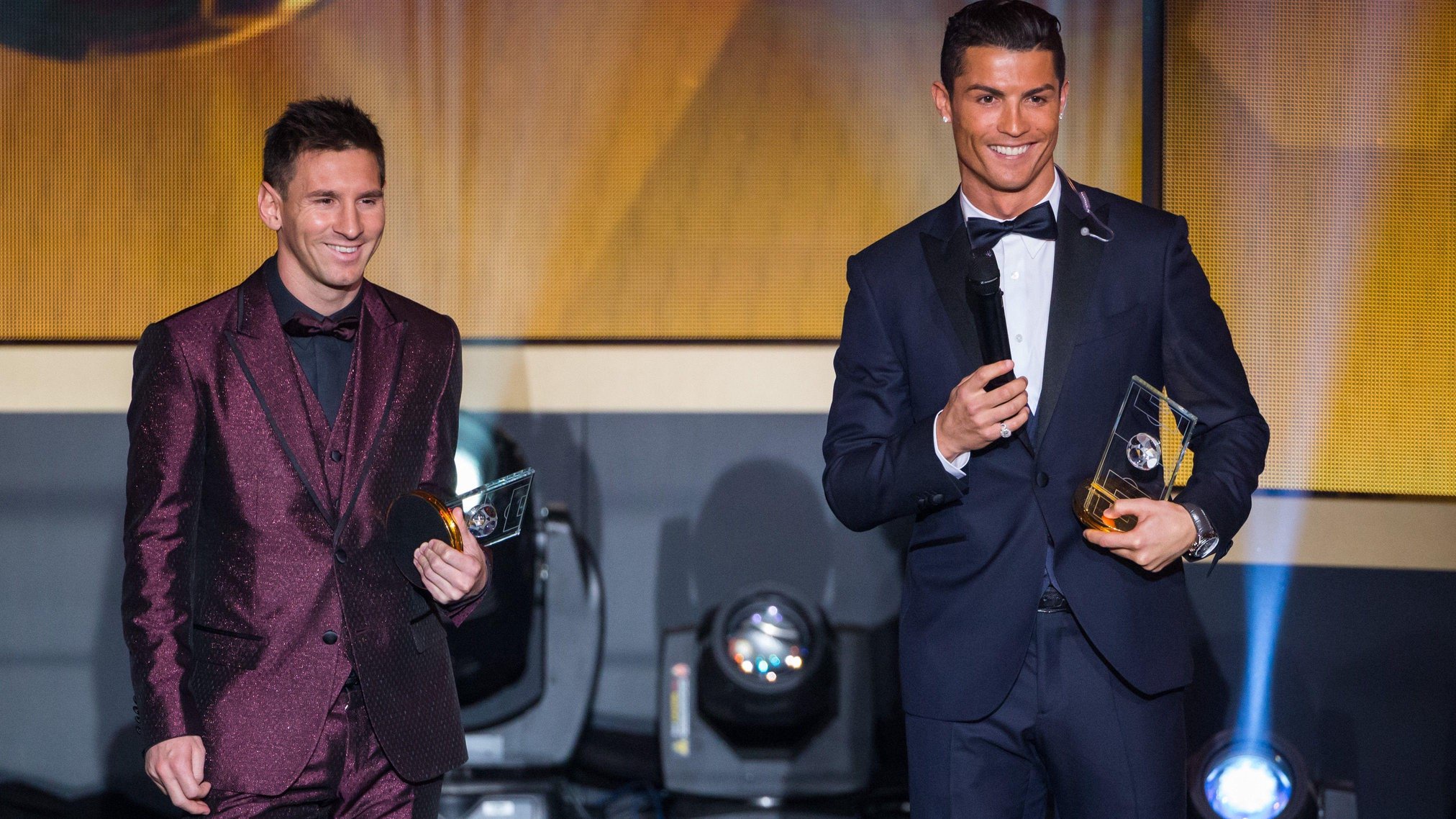 Lionel Messi and Cristiano Ronaldo stand on stage together in 2015