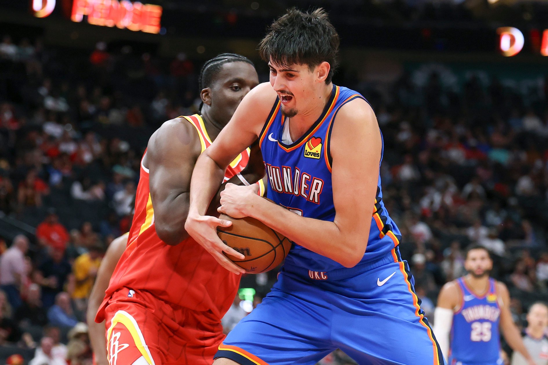 Oct 15, 2026; Houston, Texas, USA; Oklahoma City Thunder center Aday Mara (15) secures a rebound away from Houston Rockets center Clint Capela (30) during the third quarter at Toyota Center. Mandatory Credit: Troy Taormina-Imagn Images