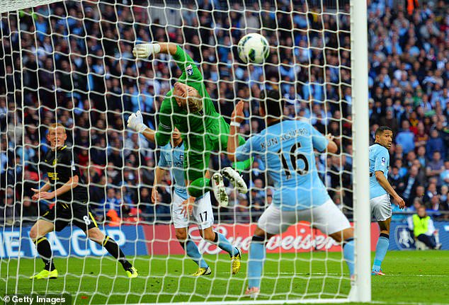 Wigan's Ben Watson heads in a late winner in the 2013 FA Cup final, shocking Man City as they were about to enter a period of dominance in English football