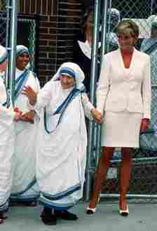 NEW YORK, NEW YORK - JUNE 18: Diana, Princess of Wales, wearing a cream suit, holds hands with Mother Teresa following a meeting in the Bronx on June 18, 1997 in New York, NYC. (Photo by Anwar Hussein/Getty Images)