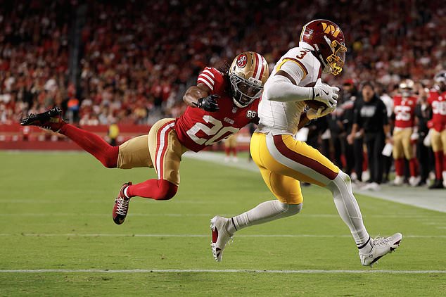 Washington Commanders wide receiver Stefon Diggs (3) scores past San Francisco 49ers cornerback Upton Stout (20) during the second half of an NFL football game in Santa Clara, Calif., Monday, Oct. 19, 2026. (AP Photo/Kelley L. Cox)