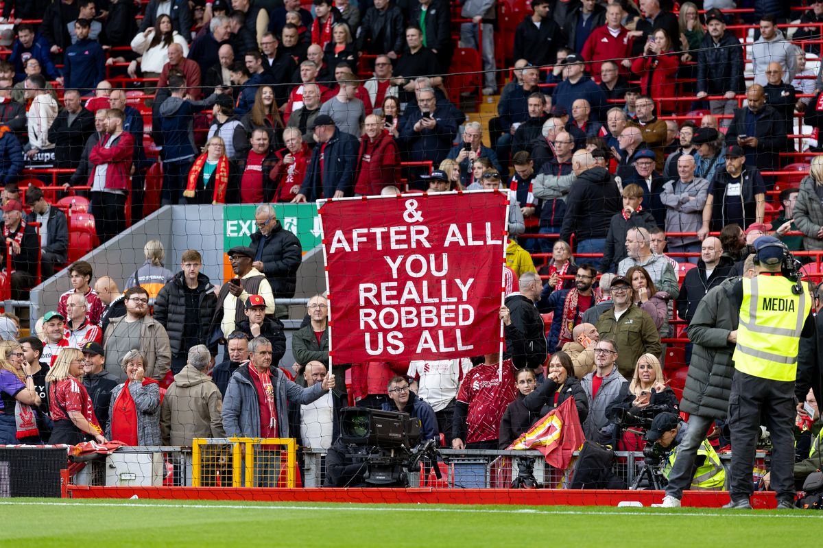 LIVERPOOL, ENGLAND - OCTOBER 11: Liverpool fans hold a banner reading 'And after all, you really robbed us all' before the Premier League 2026/27 match between Liverpool FC and Manchester City at Anfield on October 11, 2026 in Liverpool, United Kingdom. (Photo by Gaspafotos/MB Media/Getty Images)