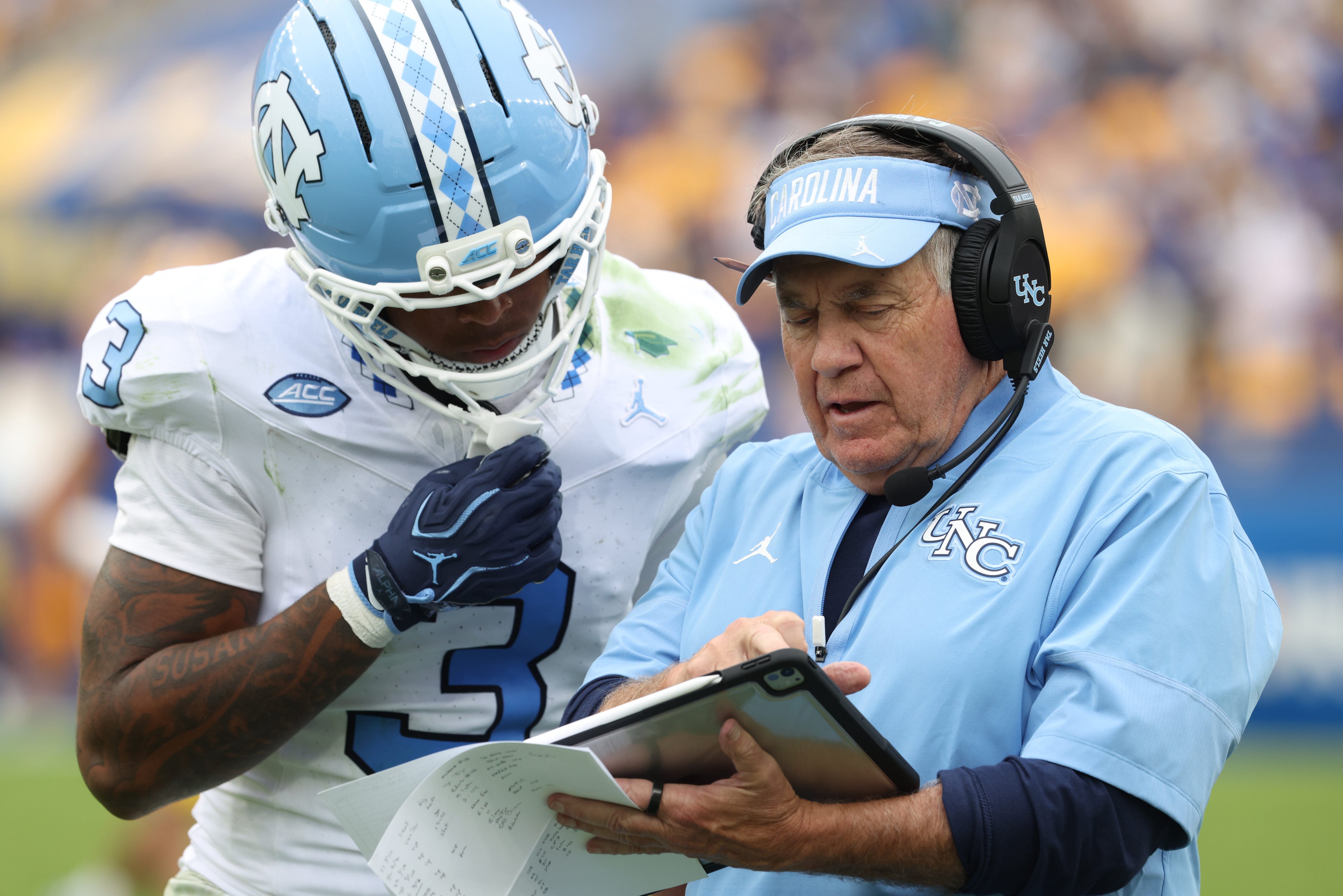 Oct 10, 2026; Pittsburgh, Pennsylvania, USA;  *North Carolina Tar Heels defensive back Ade Willie (3) talks with North Carolina Tar Heels head coach Bill Belichick (right) during the fourth quarter against the Pittsburgh Panthers at Acrisure Stadium.  Mandatory Credit: Charles LeClaire-Imagn Images
