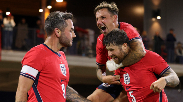 England's cerebral palsy team celebrate scoring a goal