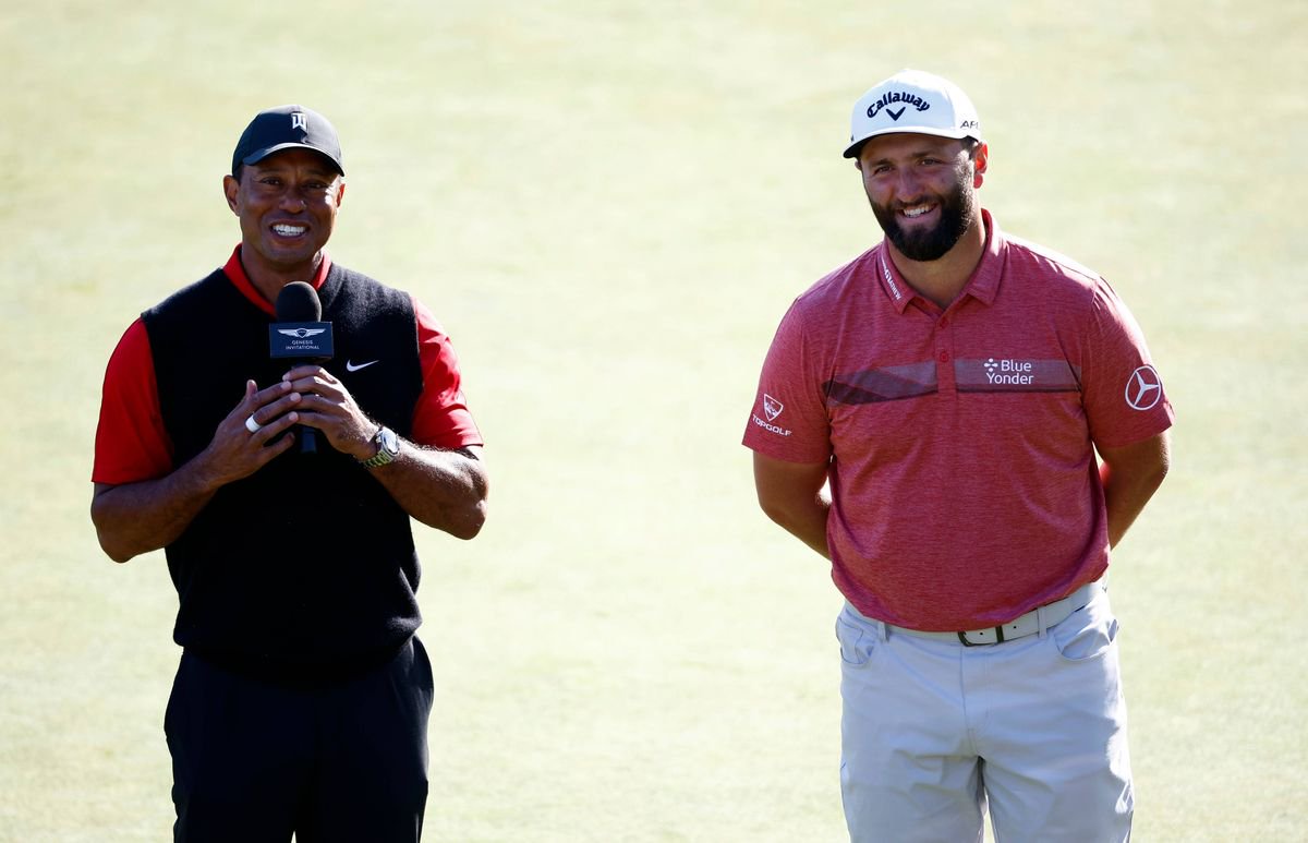 Jon Rahm with Tiger Woods