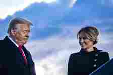 JOINT BASE ANDREWS, MARYLAND - JANUARY 20: President Donald Trump and First Lady Melania Trump pause