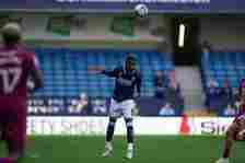 Japhet Tanganga of Millwall during the Sky Bet Championship match between Millwall and Cardiff City at The Den on April 13, 2024 in London, England.