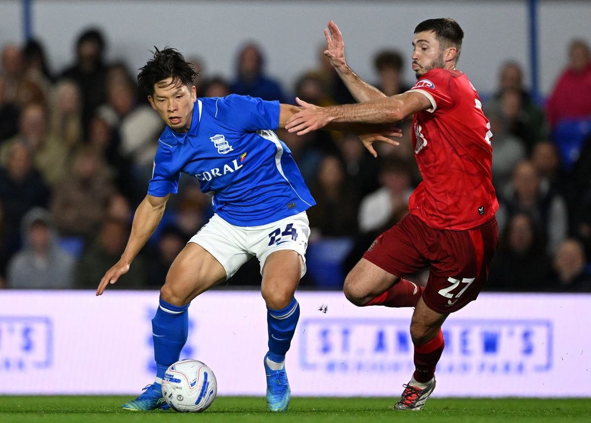 Tomoki Iwata of Birmingham City is challenged by Leo Leroy of Preston North End