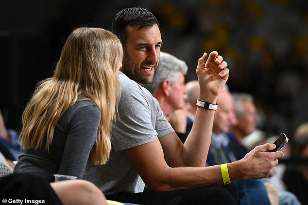 NBA legend Andrew Bogut's neighbour says she's struggling after she was accused of stabbing his child¿s basketball and throwing it at the youngster in a bitter backyard dispute