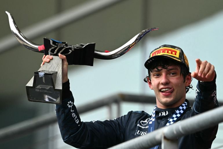 Mercedes Italian driver Kimi Antonelli holds the trophy