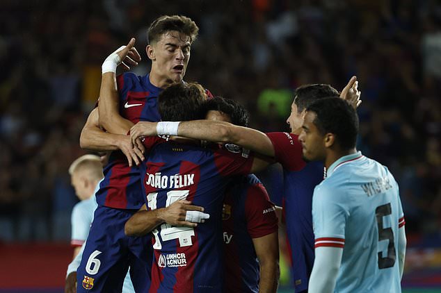Barcelona's Joao Felix, foreground, celebrates with his teammates after scoring his side's opening goal during the Champions League Group H soccer match between Barcelona and Royal Antwerp at the Olympic Stadium of Montjuic in Barcelona, Spain, Tuesday, Sept. 19, 2023. (AP Photo/Joan Monfort)