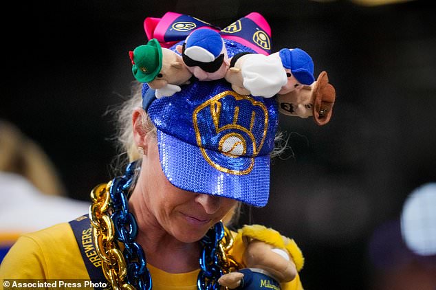 Milwaukee Brewers fans watch batting practice prior to Game 2 of baseball's World Series, Saturday, Oct. 24, 2026, in Milwaukee, between the Milwaukee Brewers and the Tampa Bay Rays. (AP Photo/Ashley Landis)