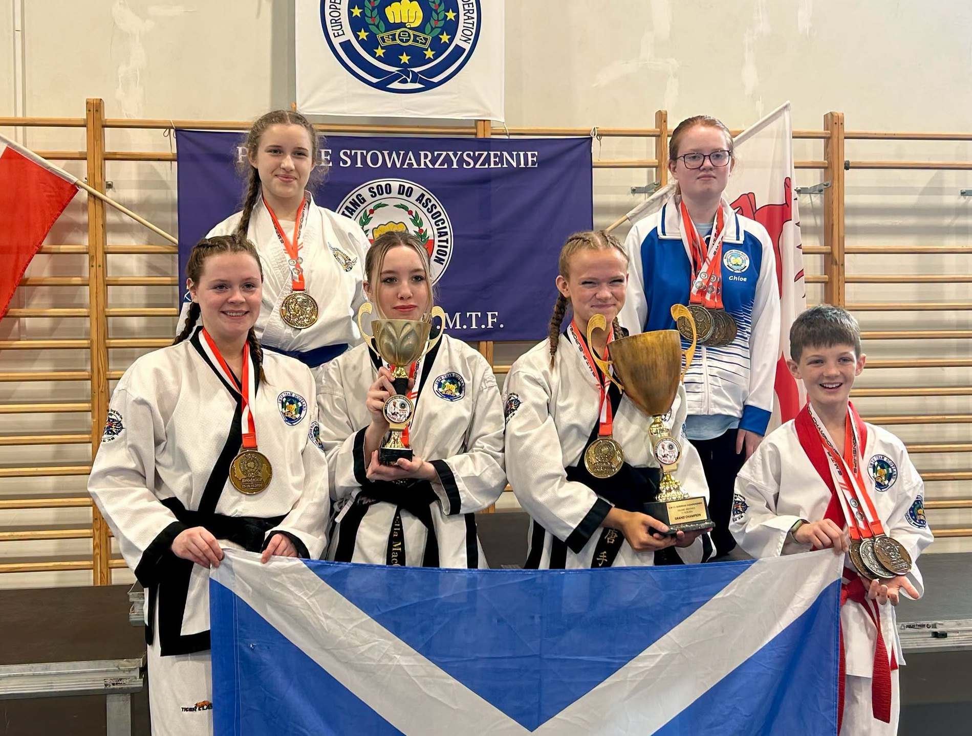 Evolution students Ella MacGillivray (front, second left) and Jack Grant (right) represented Scotland at an international event in Poland.