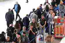 Passengers wait in a queue at Frankfurt Airport in Germany on February 1 this year