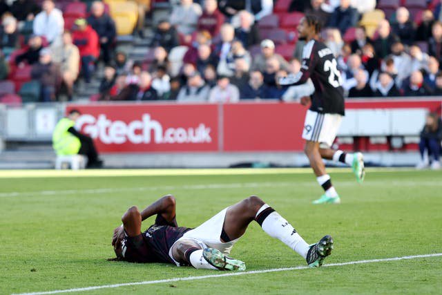 Jeremy Jacquet of Liverpool reacts after clashing with Yehor Yarmolyuk of Brentford