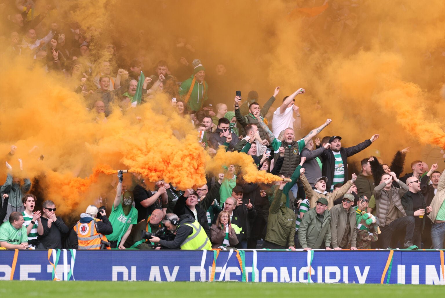 Fans of Celtic set of smoke flares in the stands prior to the Scottish Gas Scottish Cup Quarter Final match between Rangers and Celtic