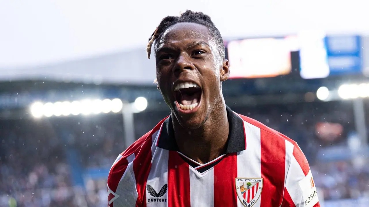 Nico Williams shouting in celebration while wearing an Athletic Club jersey