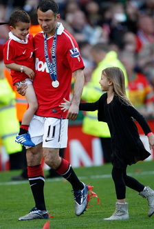 The Manchester United legend with kids Zach and Libby after a Premier League title win in 2011