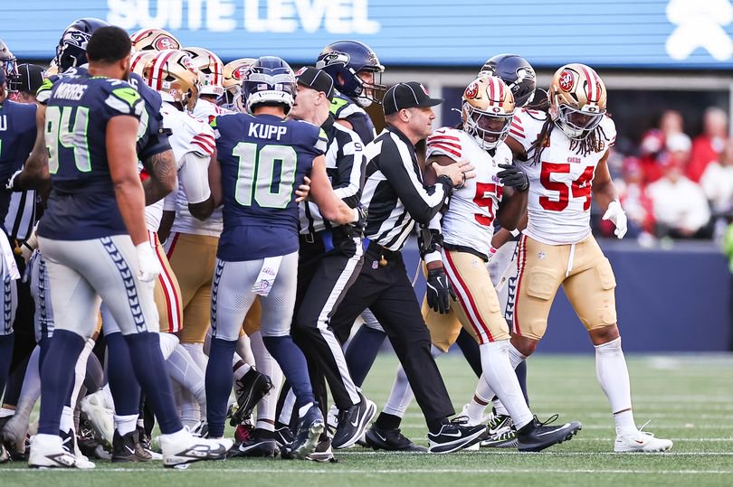 Greenlaw of the San Francisco 49ers was escorted away from the Seattle Seahawks sideline