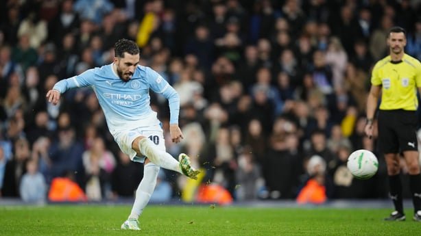 Rayan Cherki of Manchester City scores his side's fourth penalty in the shootout during the Carabao Cup Fourth Round match between Manchester City and Brighton & Hove Albion at Etihad Stadium on October 28, 2026 in Manchester, England.