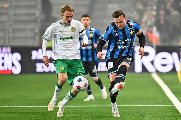 Sirius' Henrik Ronnlof Castegren, right, plays the ball as Hammarby's Victor Stange Lind closes induring the Swedish league soccer match between Hammarby IF and IK Sirius FK in Stockholm, Sweden, Thursday, Oct. 29, 2026. (Anders Wiklund/TT News Agency via AP)