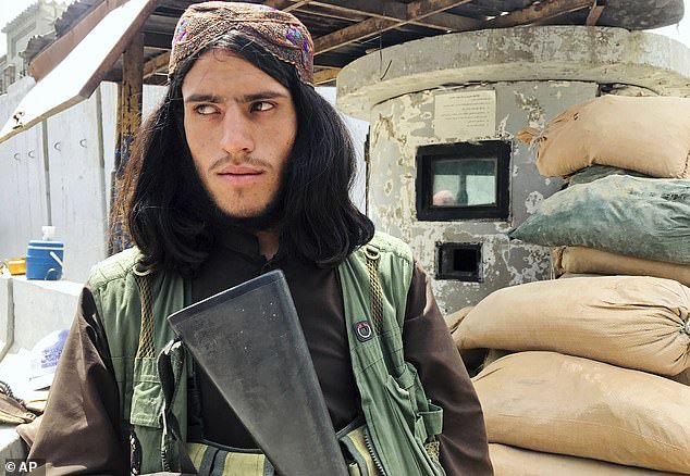 Foreign nationals and Afghans had to navigate Taliban checkpoints around the city, like this one (previously manned by American troops) close to the abandoned U.S. embassy